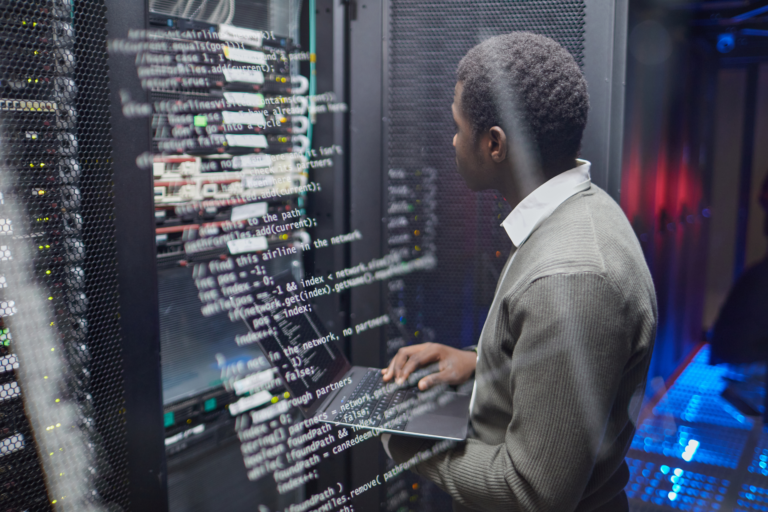 Entry-level IT professional configuring computer network equipment.