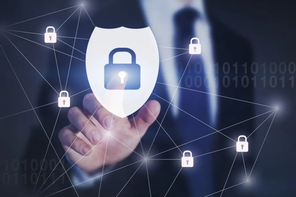 Cybersecurity analyst monitoring multiple security alerts on computer screens.