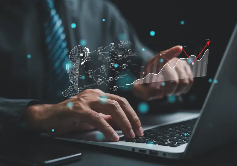 Data analyst reviewing AI-powered business insights on multiple computer screens.