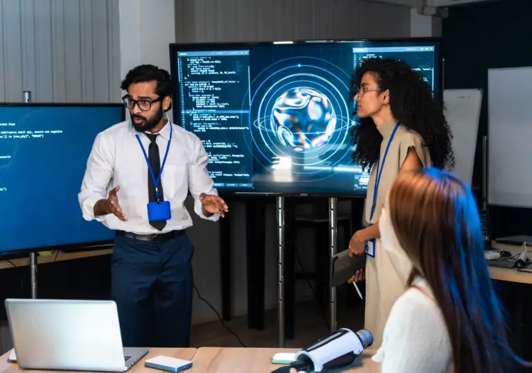 Data analyst reviewing AI-powered business insights on multiple computer screens.