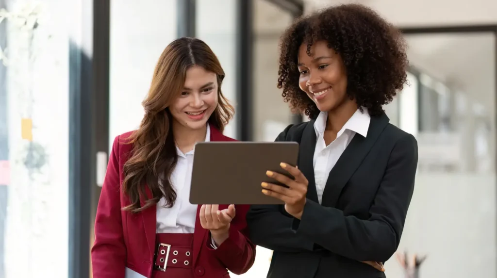 Digital marketing professional reviewing campaign analytics on a laptop.